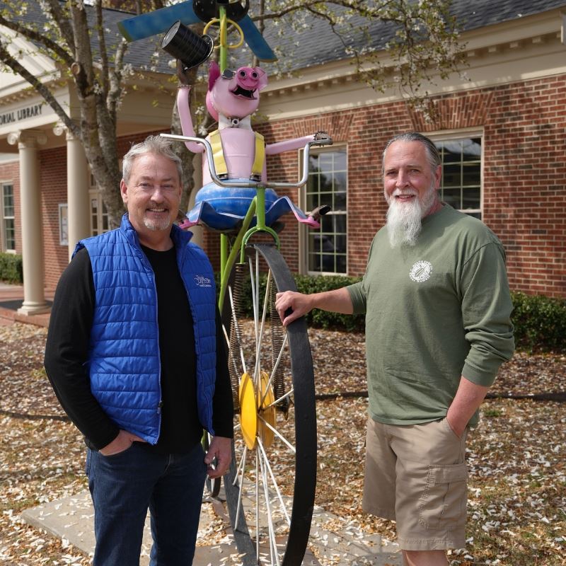 Artist Jason Morris stands with Mayor Jody Mcleod in front of award winning sculpture